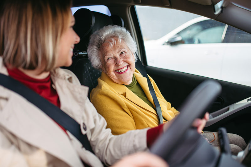 An Envigor carer drives a client to an appointment.