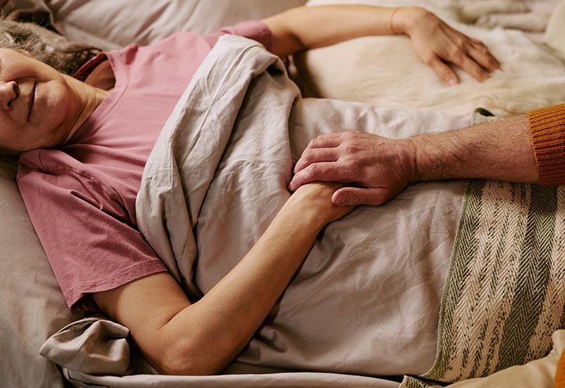 An Envigor nurse provides palliative care support to an elderly patient at home in Queensland.