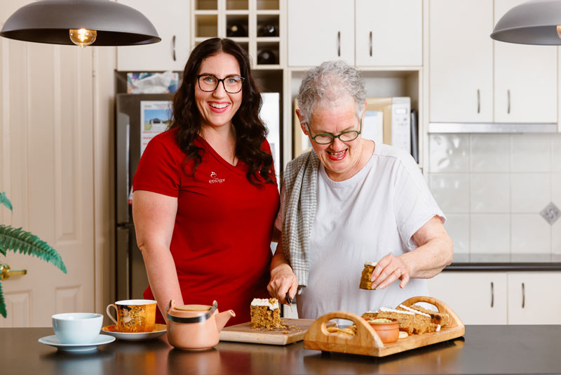 An Envigor personal carer helps a client with home care in Queensland